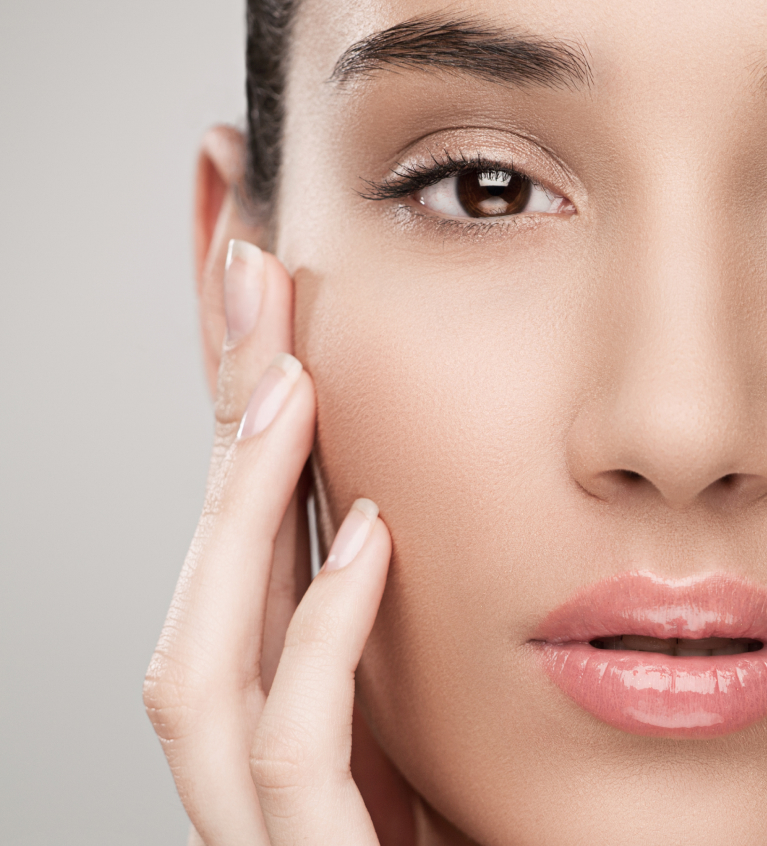 Woman with hand on face after using products